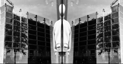 Mirrored storefront, white jacket