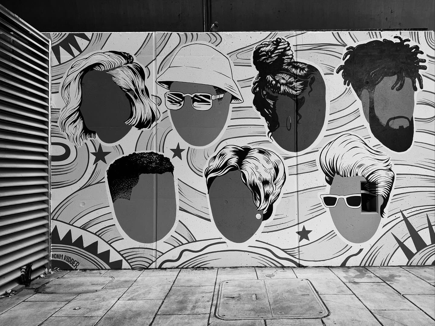 B&W mural, six faceless heads