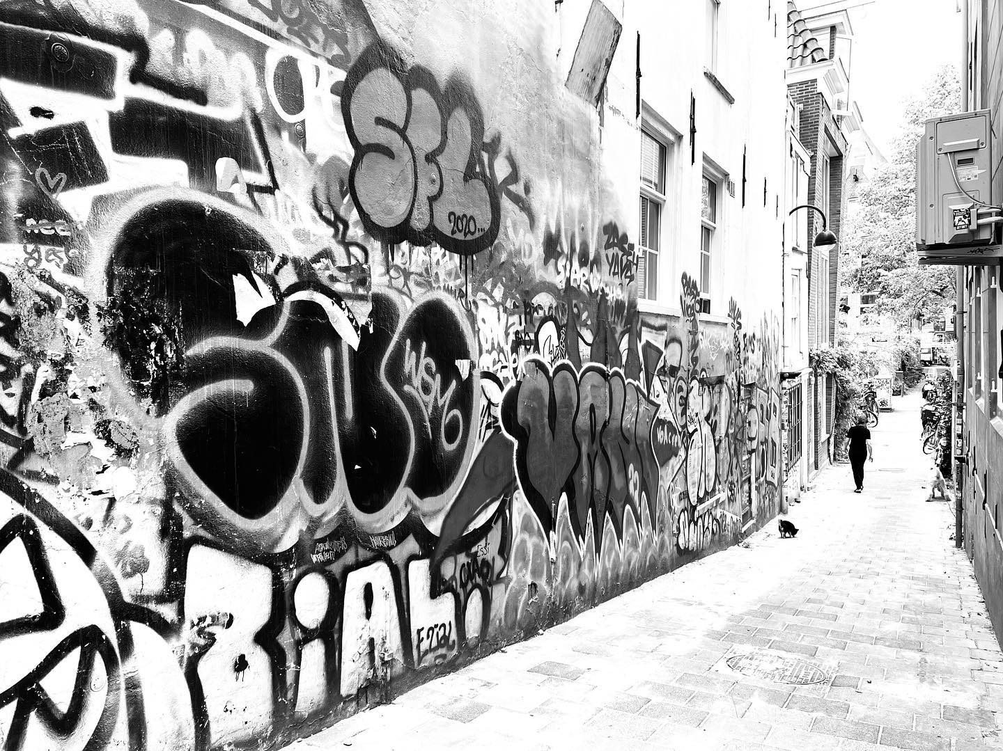 Graffiti alley, figure walking away